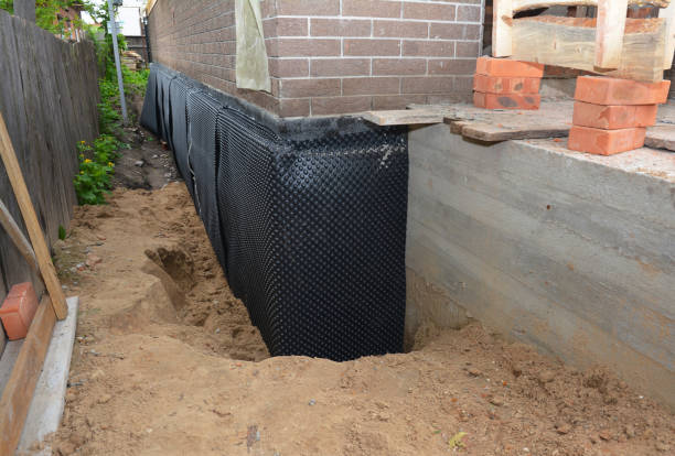 SJ Waterproofing Pros technician performing targeted Interior Drainage System assessment in Mill Neck, NY